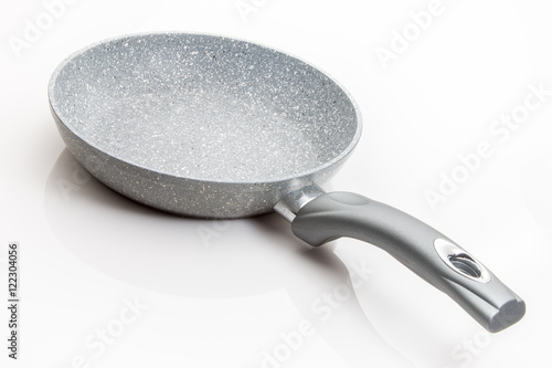 Skillet with stonewear finish on a white background. photo