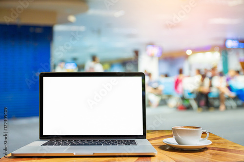 laptop for blank and coffee on a table showing break or breakfas photo