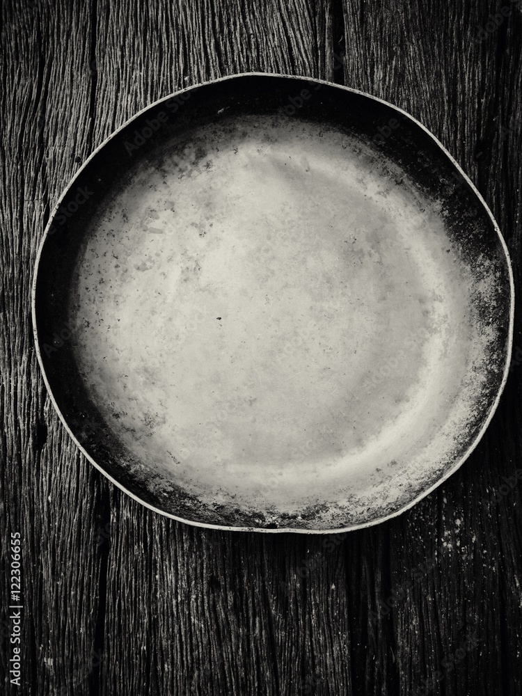 Antique bowl on wood background black and white tone Antique bowl on wood background black and white tone