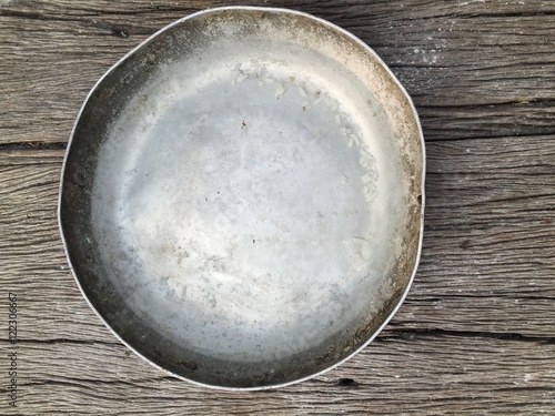 Antique bowl on wood background