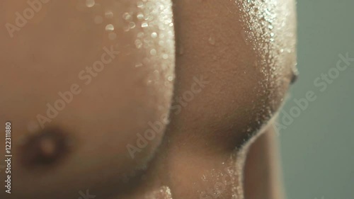 Close up of sportsman sweaty body. Slowly
