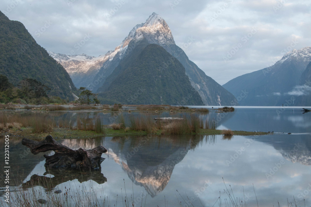 Mitre Peak in Milford Sound, New Zealand, at dusk Mitre Peak in Milford Sound, New Zealand, at dusk