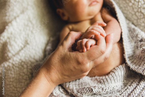 Newborn baby hand holding mother Finger photo