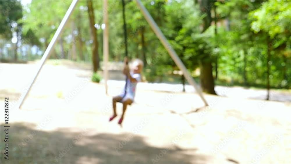 Slow motion of a cute young girl goes zip lining Slow motion of a cute young girl goes zip lining