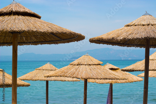 Straw sunshades on the beach