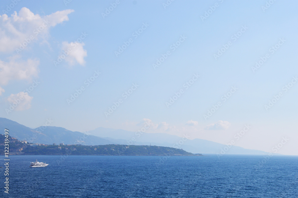 Luxury yacht making a travel cruise near Monaco seaside early in the morning