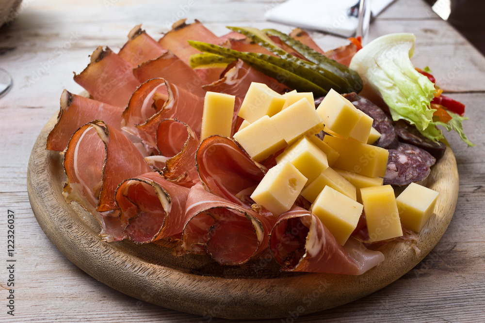 Speck and cheese cold cuts platter South Tyrol. The plate after