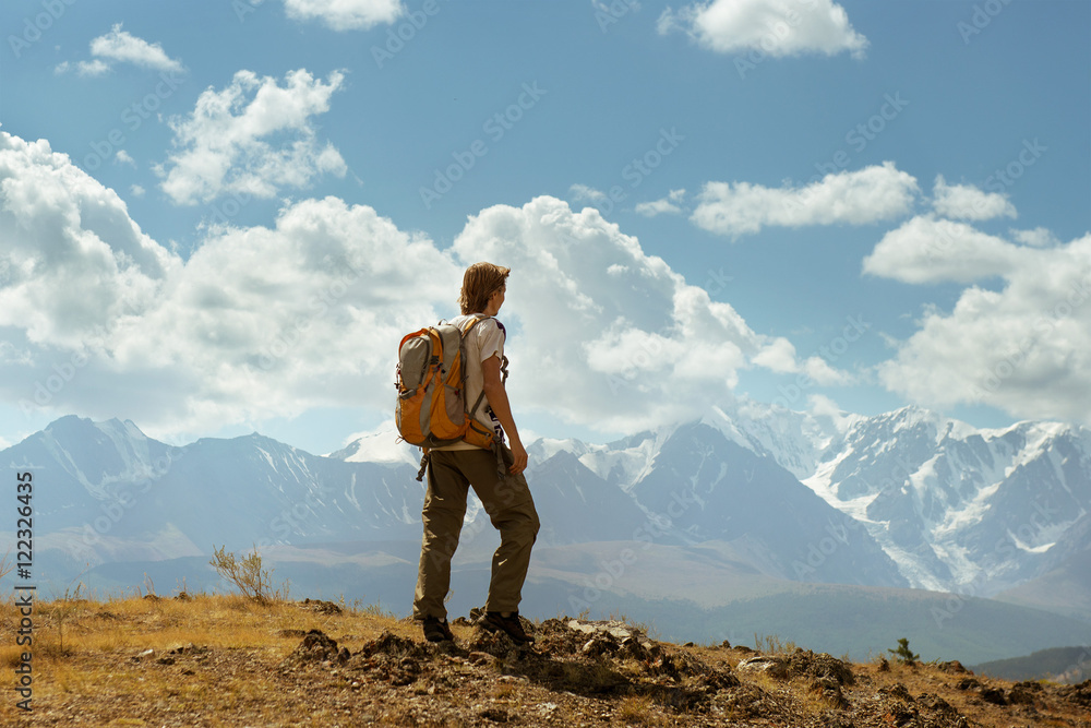 Man stands on the mountains background