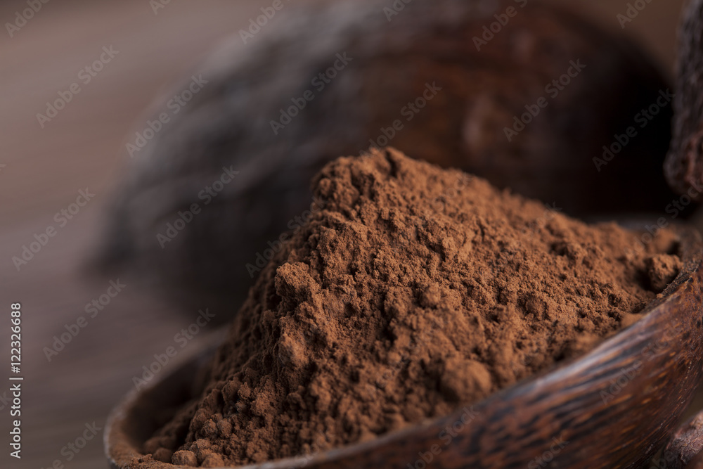 Chocolate bar, candy sweet, cacao beans and powder on wooden bac Chocolate bar, candy sweet, cacao beans and powder on wooden bac