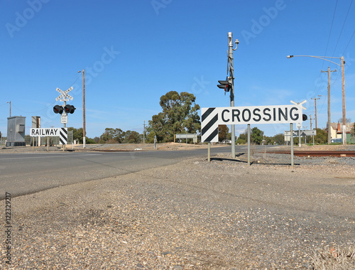 lights and signs at a three-line railway crossing