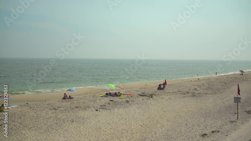 Wide view of people on Ho Hum beach on Fire Island photo