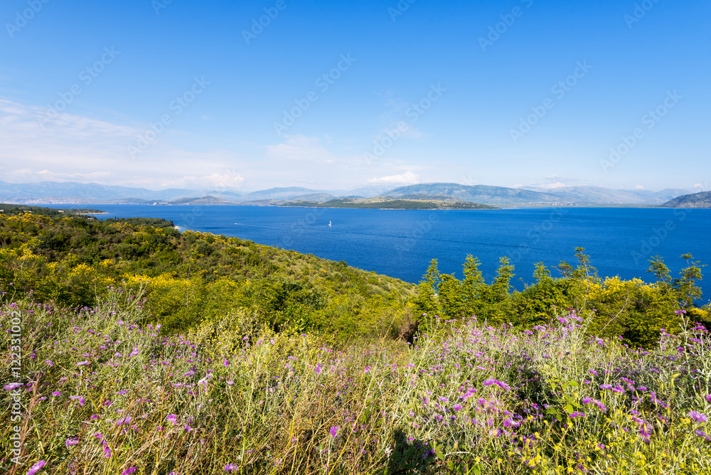 The Straits of Corfu or Corfu Channel. The narrow body of water along the coasts of Albania and Greece. Beautiful view from coast road of Corfu Island.