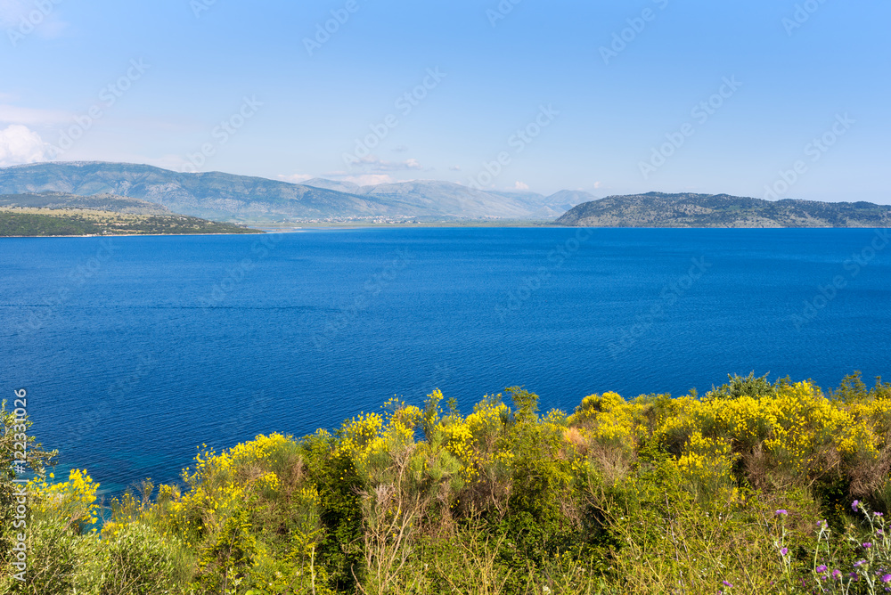 The Straits of Corfu or Corfu Channel. The narrow body of water along the coasts of Albania and Greece. Beautiful view from coast road of Corfu Island.