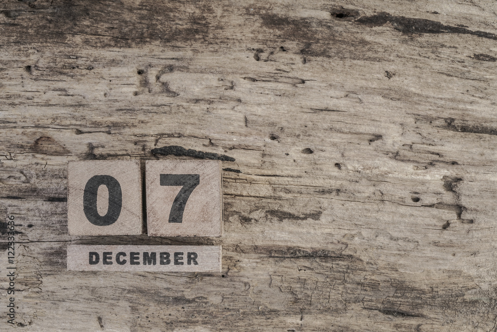 cube calendar for december on wooden background with copy space cube calendar for december on wooden background with copy space