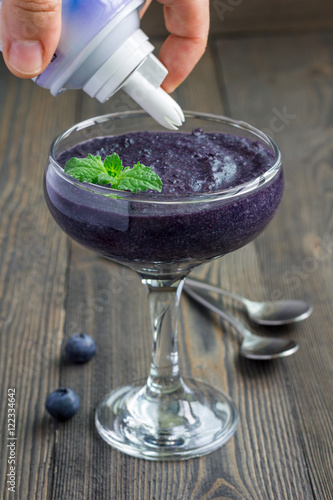 Healthy boiled egg blueberry mousse with whipping cream in glass photo