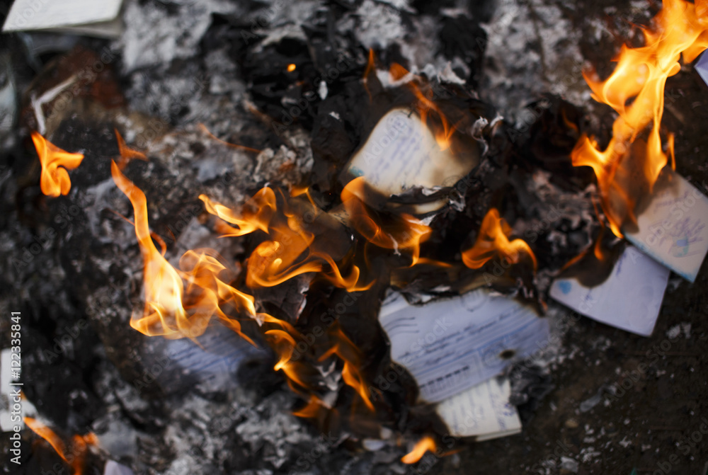 burning paper letters closeup. envelopes and letters on fire burning paper letters closeup. envelopes and letters on fire
