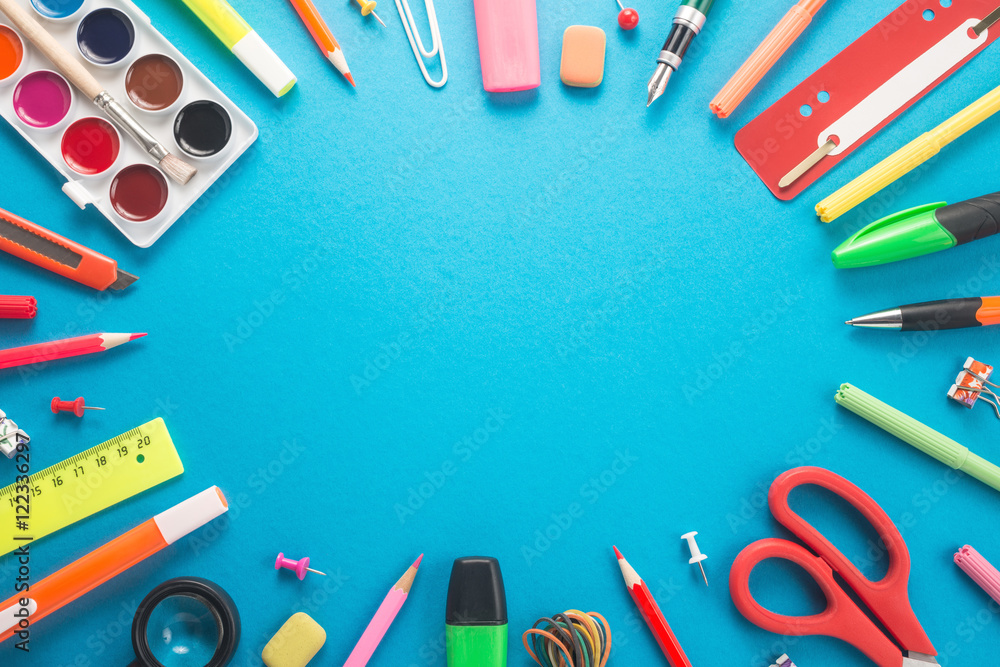 School office supplies on blue background