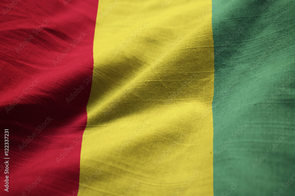 Closeup of Ruffled Guinea Flag, Guinea Flag Blowing in Wind Closeup of Ruffled Guinea Flag, Guinea Flag Blowing in Wind