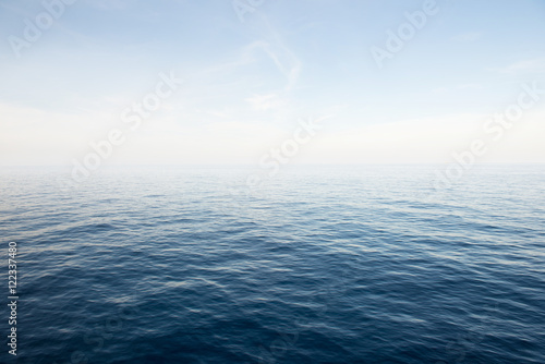 Blue sea and blue sky background. © meawnamcat