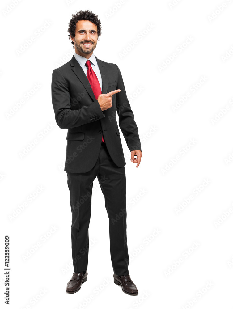 Handsome businessman pointing his finger to the right Handsome businessman pointing his finger to the right
