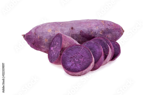 Pile of ripe purple sweet potatoes isolated on White background