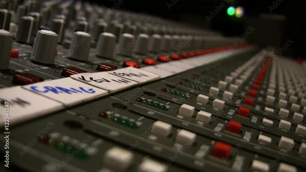 A close up shot of a mixing board in a recording studio with illuminating LED lights. HD 1080. A close up shot of a mixing board in a recording studio with illuminating LED lights. HD 1080.