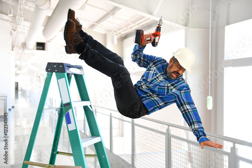 Fényképezés Hispanic Worker Falling from Ladder