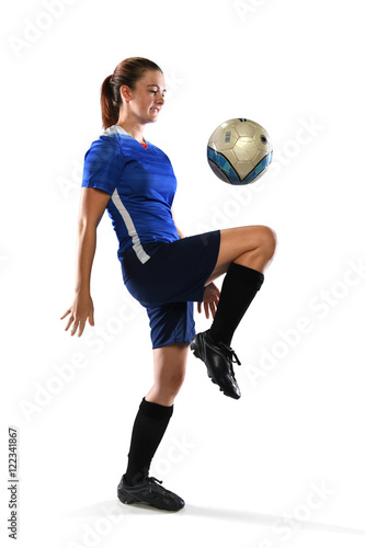 Female Soccer Player Bouncing Ball