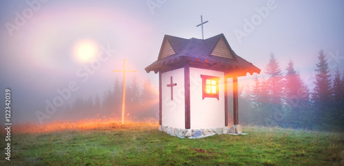 Fototapeta Naklejka Na Ścianę i Meble -  Moonrise over the small church in Carpathians