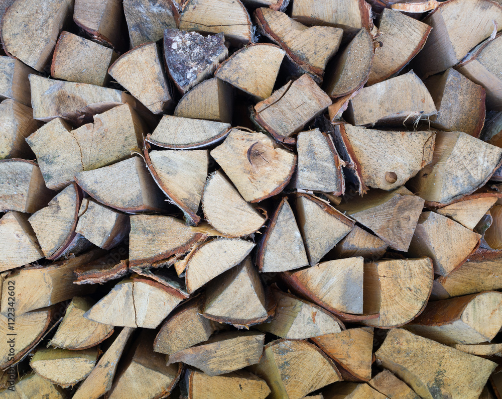 Fototapeta premium Background of dry chopped firewood logs