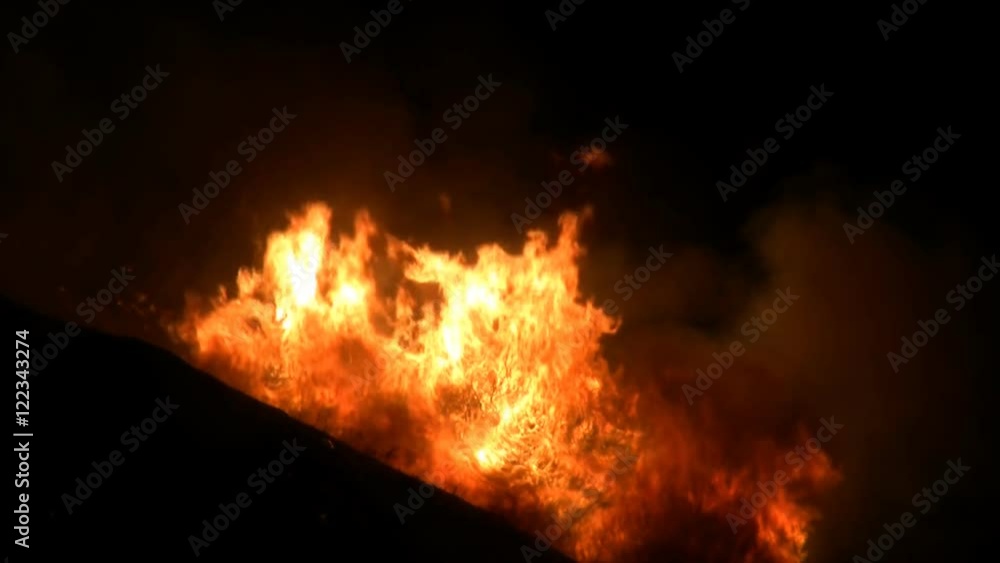 An out of control wildfire blazes through Southern California at night. HD 1080. An out of control wildfire blazes through Southern California at night. HD 1080.