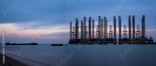 Sunset on oil rigs