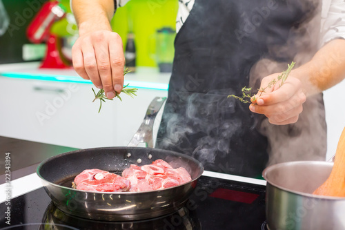 Obraz na plátně Man cooking at home