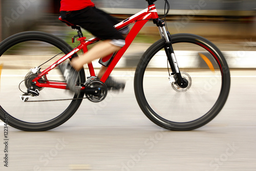 Biking in the morning with leg movements cyclists blurry