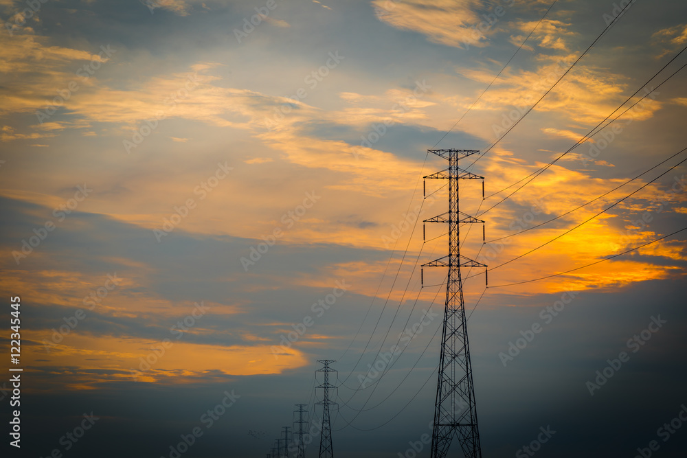 Silhouettes Electricity transmission line and tower during sunset
