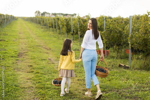 Mother and daughter in vine...