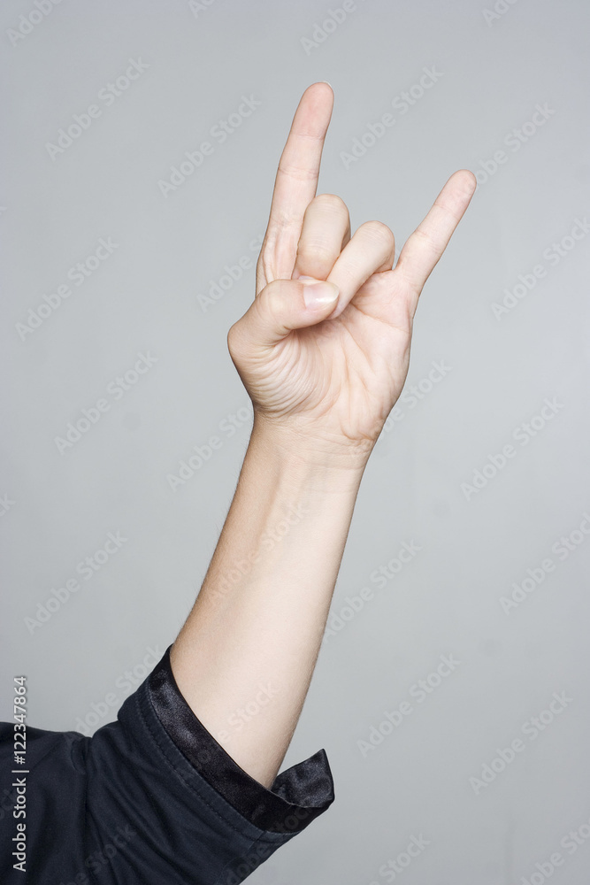 Woman's hand giving the Rock and Roll sign, devil horns gesture Stock ...