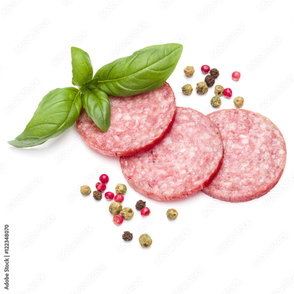 Salami smoked sausage three slices, basil leaves and peppercorns Salami smoked sausage three slices, basil leaves and peppercorns