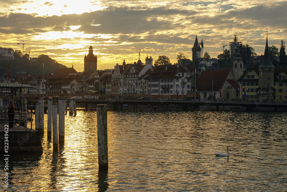 Sunset view of pier. Lucerne lake and old town at background. Lucerne, Switzerland