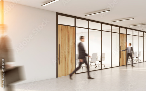 Conference room with people in corridor