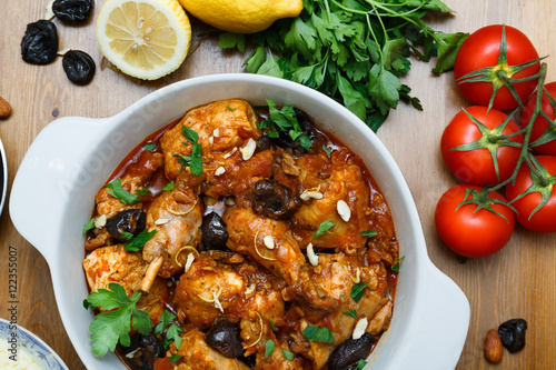 meal of chicken tagine stew in a spicy, nutty tomato sauce and prunes