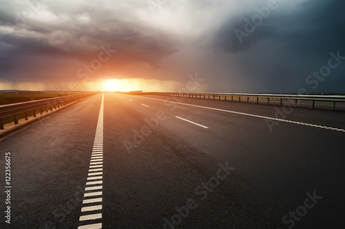 Принти на полотні highway asfalt road and beautiful dramatic cloudy sky