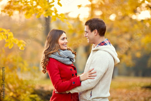 Smiling woman and man in love in park