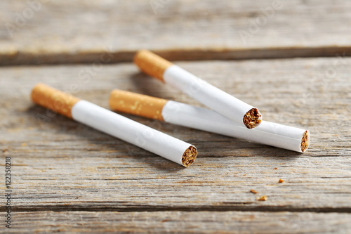 Tobacco cigarettes on a grey wooden table