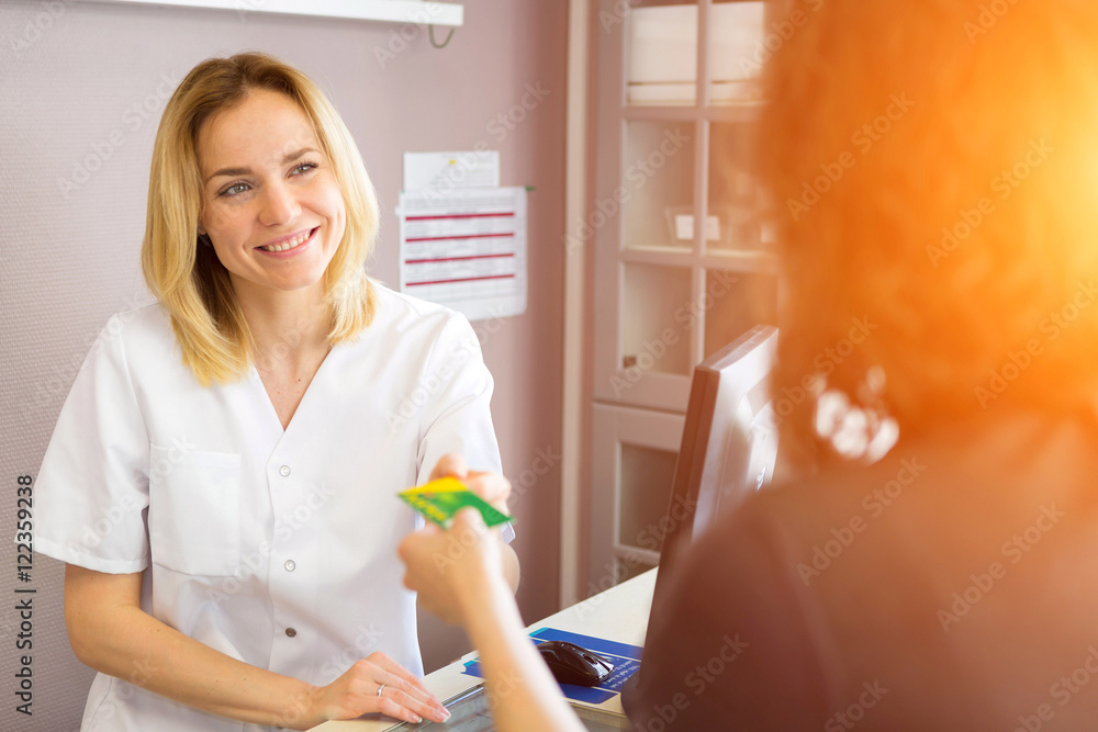 Beautician woman get credit card of customer to do payment Beautician woman get credit card of customer to do payment