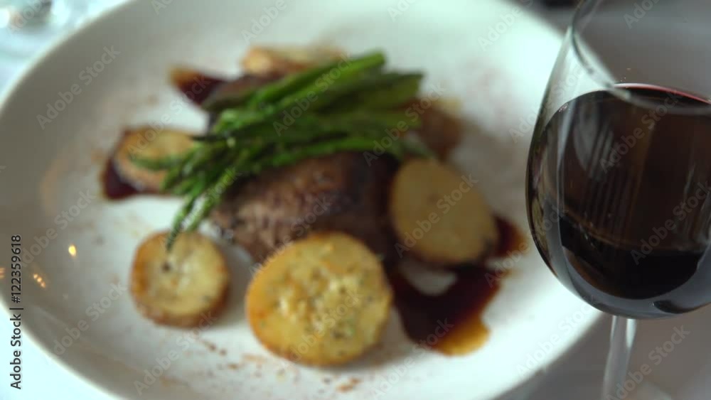 Left pan of a fillet mignon meal with red wine Left pan of a fillet mignon meal with red wine