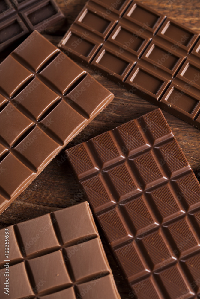 Chocolate bar, candy sweet, dessert food on wooden background Chocolate bar, candy sweet, dessert food on wooden background