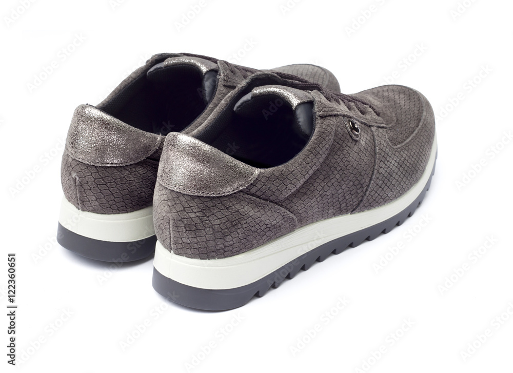 Female suede sneakers isolated on white background with clipping path