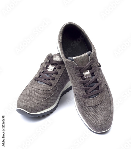 Female suede sneakers isolated on white background with clipping path