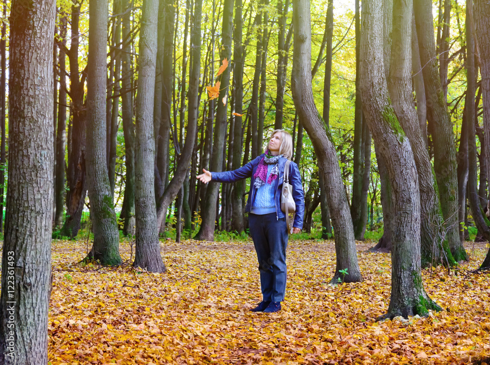 Happy woman walking in autumn Park Happy woman walking in autumn Park